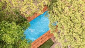 An aerial view of a swimming pool surrounded by dense greenery. - Jesolo Family Resort (Jesolo)