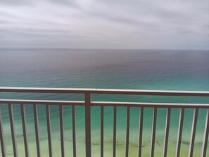 A balcony with a view of the ocean.