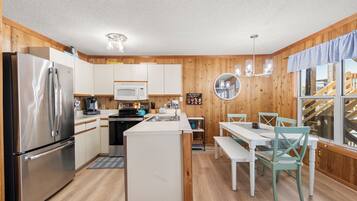 Coffee/tea maker, fridge, microwave, oven