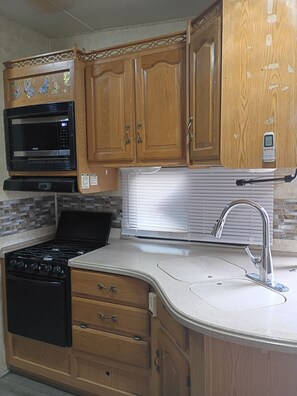 Private kitchen - 1-bedroom recreational vehicle in tranquil Guy, Texas on a beautiful horse farm. (Guy)