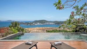 A poolside view with a clear view of the sea and a distant town. - Villa Nha Trang Ocean Front Luxury Abogo (Nam Nha Trang)