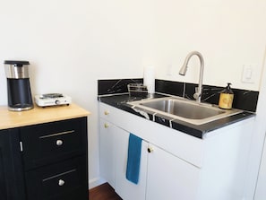 Fridge, microwave, stovetop, coffee/tea maker