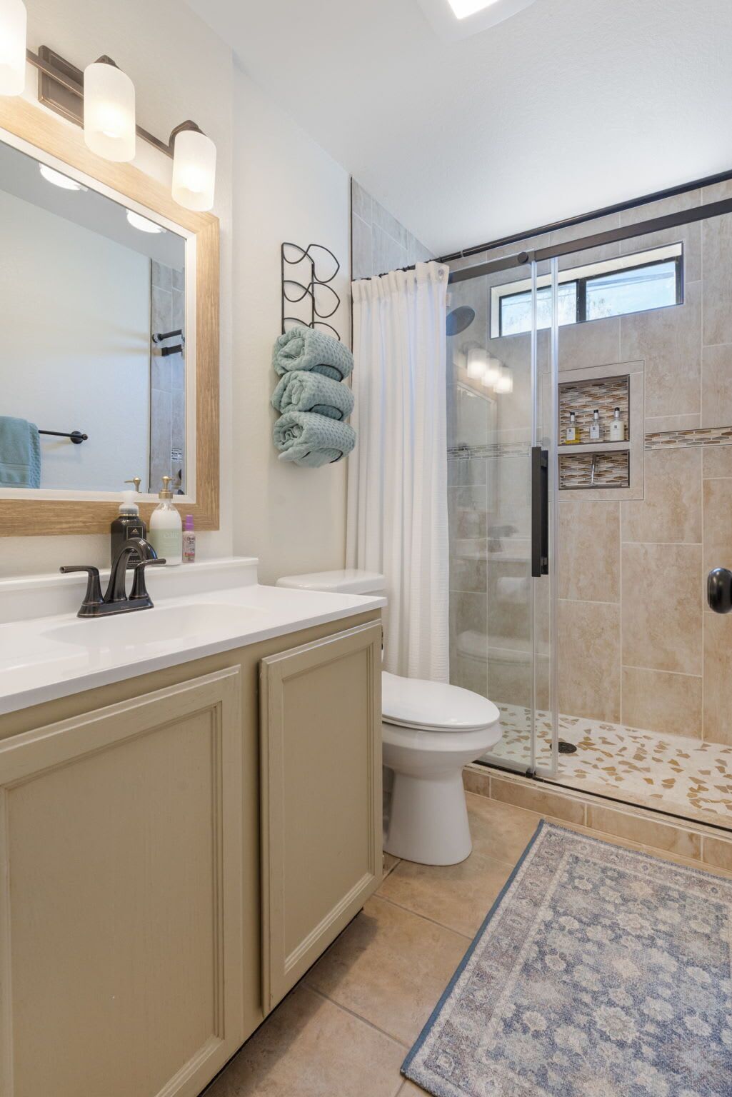 Shower, hair dryer, towels, shampoo