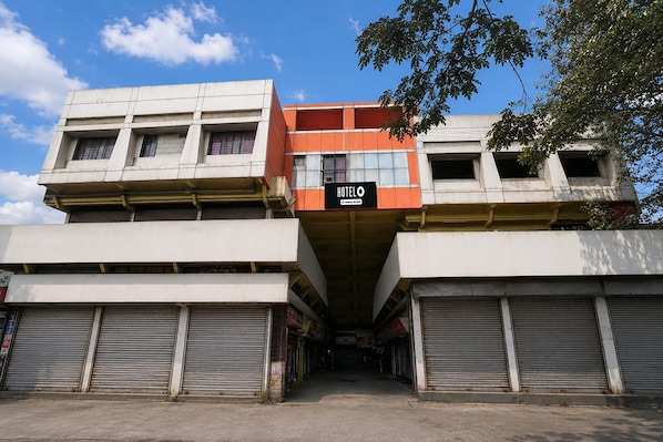 A hotel with a sign reading 'HOTEL O' and a modern architectural design. - Super Deluxe Twin Roomhotel Shiv Sai (Nashik)