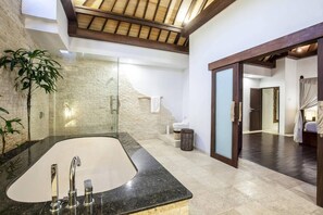 A modern bathroom with a large bathtub, a glass shower enclosure, and a wooden ceiling. - Huge Private Pool Villa Atala Canggu Seminyak 4BR (Kerobokan)
