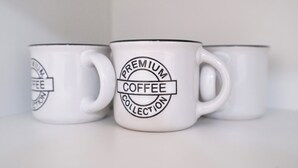 Three white ceramic mugs with black text and logos, arranged on a white surface. - revLIVING OCTAVUS for up to 7 guests in the idyllic wine village of Hohenwarth-Mühlbach (Hohenwarth)