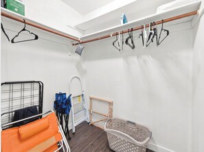 A laundry area with a drying rack, ironing board, and a laundry basket. - Baywood Colony - 2BR 2BA - Siesta Key Area (Sarasota)