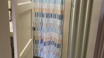 Shower, towels, soap, toilet paper