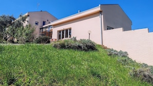 A modern two-story house with a flat roof, large windows, and a visible staircase leading to the upper floor. - Elegant Villa With Pool (Senigallia)