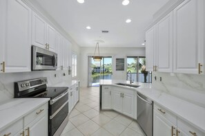 Private kitchen - Spacious 3-bedroom condo within the main gate of Miromar Lakes (Miromar Lakes)