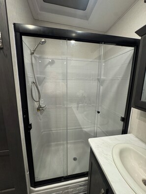 Shower, hair dryer, towels, soap