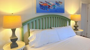 A bed with white bedding, a green headboard, and two bedside lamps. - The Tinker Bell at Moody Beach- Turtle Unit 2 BR’s with partial ocean views (Wells)