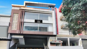 A modern building with a sign reading 'Collection.' - Classic With Balconyjr inn (Lucknow)