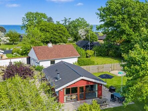 A residential property with a red-roofed house, a white house, and a view of the sea. - "Pascal" - 175m from the sea by Interhome (Frørup)