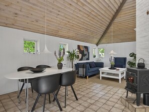 A modern interior with a dining area, sofa, and fireplace. - "Holmsten" - 250m to the fjord by Interhome (Skjern)