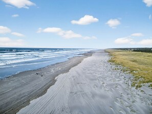 On the beach, sun loungers, beach towels