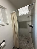 Deluxe Double or Twin Room, 2 Queen Beds | Bathroom | Shower, towels, soap, shampoo