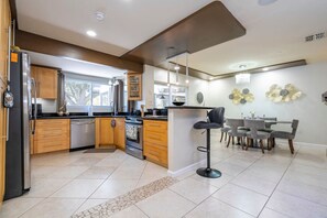 Microwave, oven, dishwasher, coffee/tea maker - Sunny Escape Near Universal | 3BR Pool Home (Orlando)
