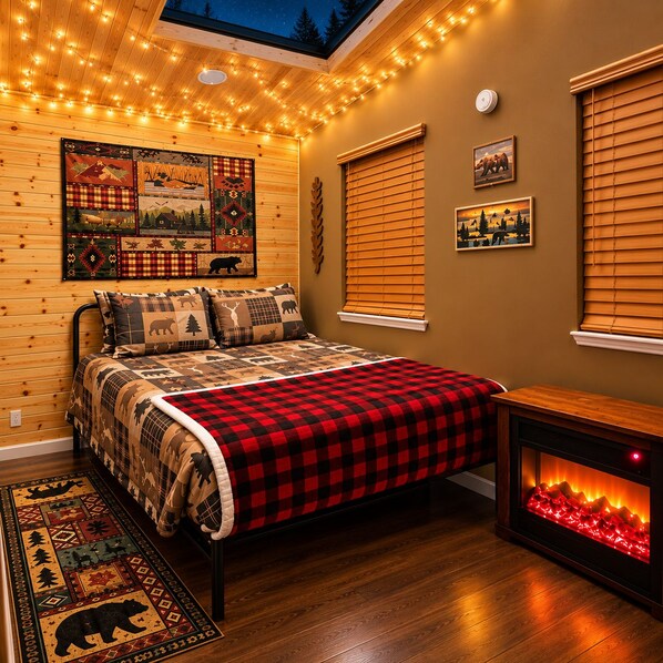 A cozy bedroom with a bed, a fireplace, and a ceiling with string lights. - Dreamy Cozy Guesthouse/Private Entrance/Queen Bed/Fireplace/Big Shower (Vallejo)
