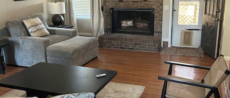 Smart TV, fireplace, books