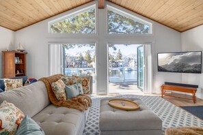 With both doors open, the sectional looks straight out to the mountains. - Emerald Oasis | Lakefront | Hot Tub | Boat Dock (South Lake Tahoe)