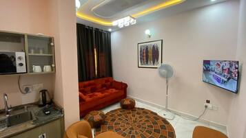 Suite, uitzicht op tuin | Woonruimte