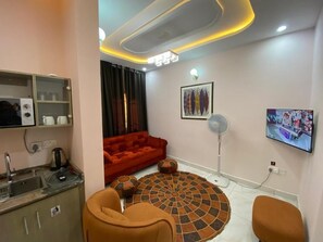 Suite, uitzicht op tuin | Woonruimte