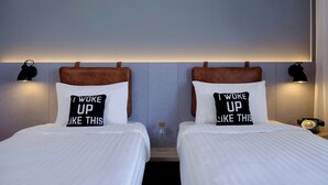 A hotel room with two beds, each with a pillow that reads 'I woke up like this.' - Moxy Belgrade Skadarlija (Belgrade)