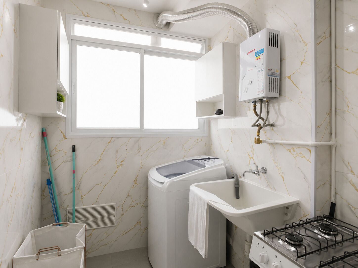 A compact bathroom with a window, a washing machine, a sink, and a stove.