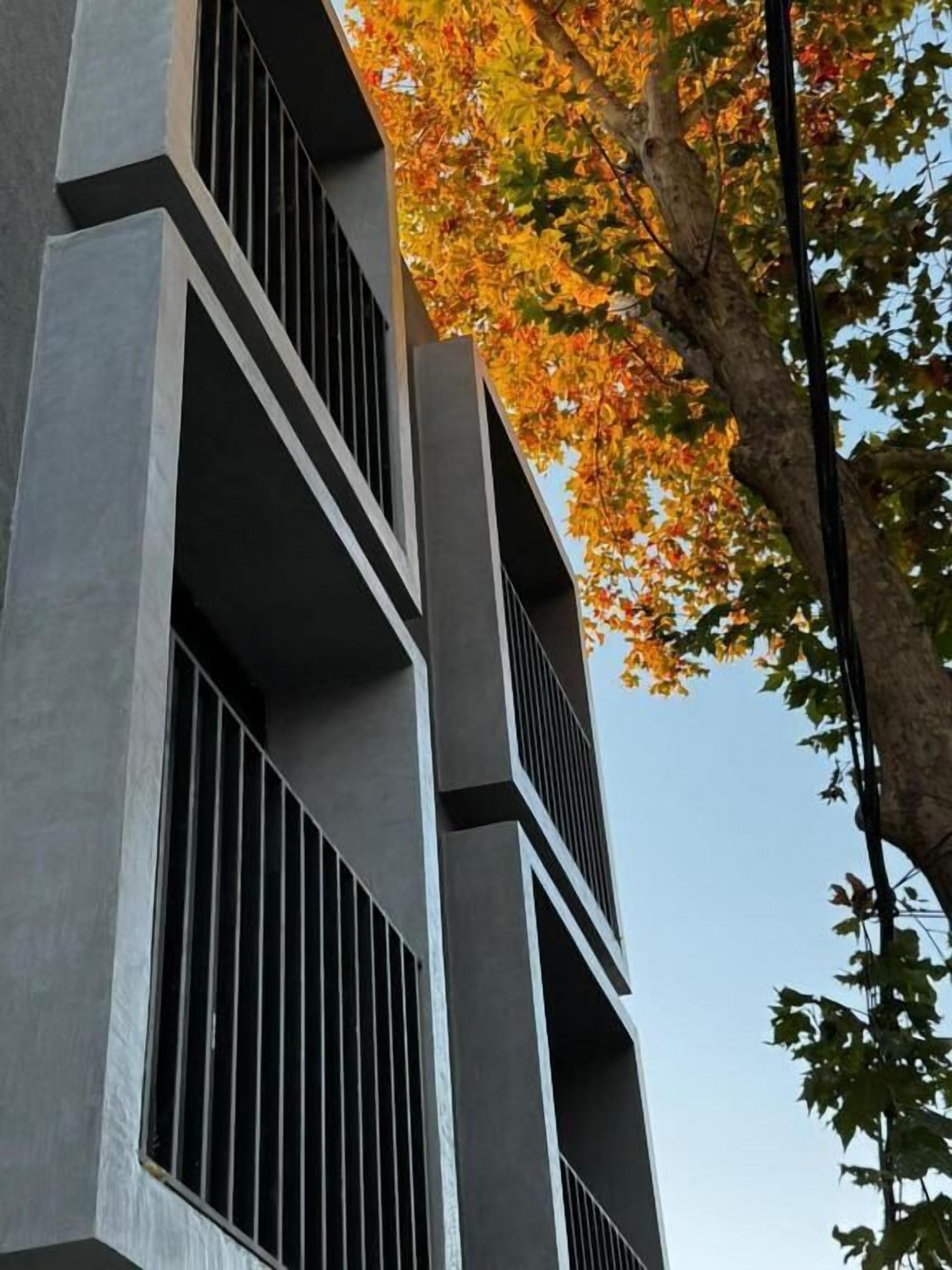 A modern building with a geometric facade and vertical lines.