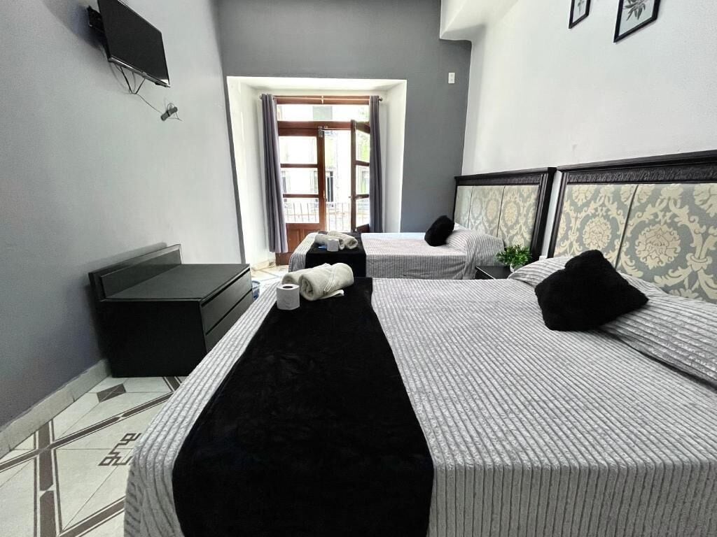 Standard Quadruple Room, 2 Double Beds, Ensuite, City View | Free WiFi, bed sheets