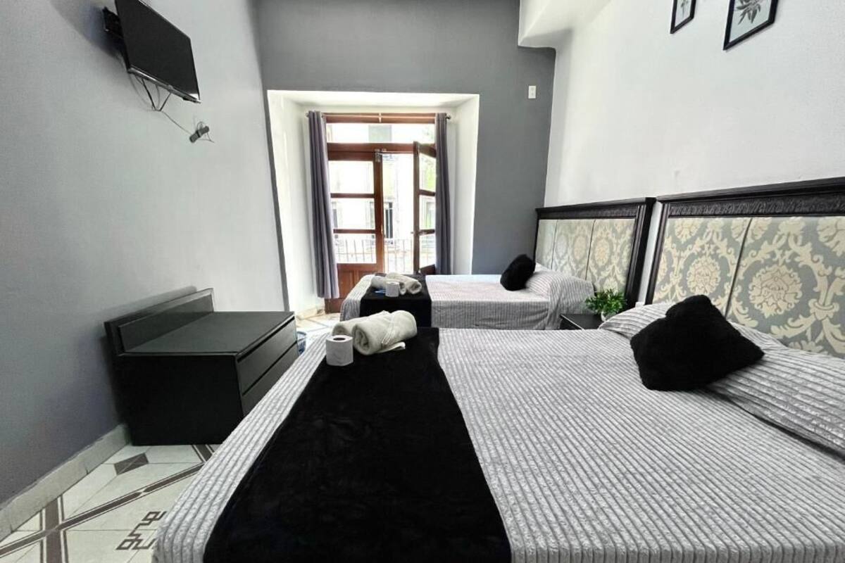 Standard Quadruple Room, 2 Double Beds, Ensuite, City View | WiFi (free), bed sheets