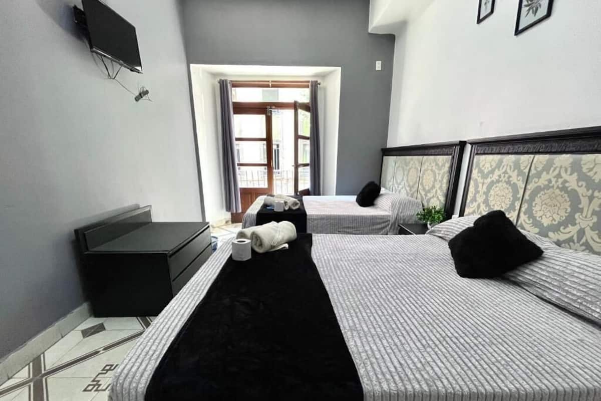 Standard Quadruple Room, 2 Double Beds, Ensuite, City View | Free WiFi, bed sheets