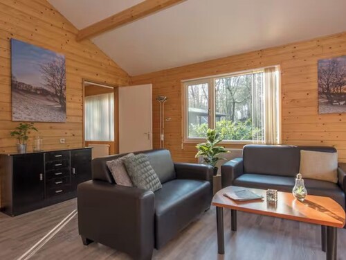 Bungalow with a bath and a view of the pond.