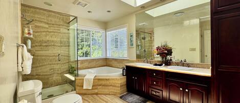 Jetted tub, hair dryer, towels, soap