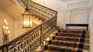 A staircase with ornate metal railings and patterned carpet. - PALAZZO TREZZA VERONA Preferred Hotels & Resorts (Verona)
