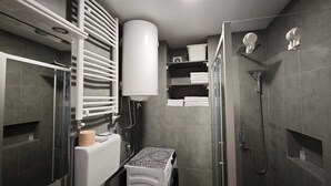 A modern bathroom with a glass shower enclosure, a built-in towel rack, a toilet, and a white radiator. - House of Mirrors Belgrade (Beograd)