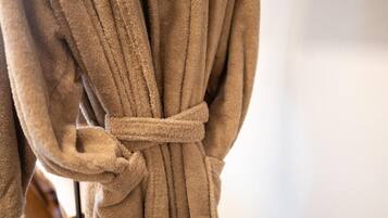 A brown robe tied around a chair.
