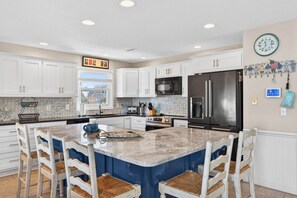 Fridge, microwave, oven, stovetop - All The Phils by Brunswick VR: 5BR/3BA Canal Home, Sleeps 20, Steps from Beach (Ocean Isle Beach)