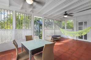 Outdoor dining - A charming San Juan escape on a quiet corner lot—featuring A/C in every room, a cozy backyard, and space for families or groups to relax, work, and explore Puerto Rico with ease ✨ (San Juan)