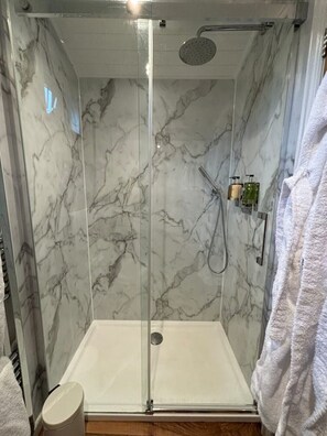 Shower, hair dryer, towels, soap