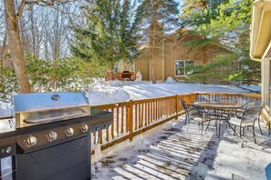 A deck with a grill, outdoor furniture, and snow on the ground. - Near Slopes, Trails & Fun! Camelback Townhome (Tannersville)