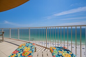 A balcony with a view of the beach and ocean. - Phoenix Gulf Towers 1803 3 Bedroom Condo (Orange Beach)