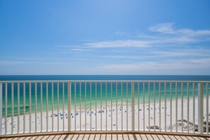 A balcony with a view of a beach and ocean. - Phoenix Gulf Towers 1803 3 Bedroom Condo (Orange Beach)