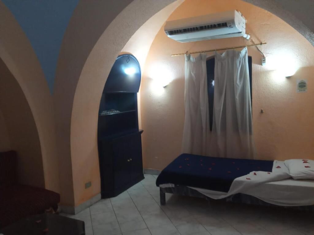 Quarto triplo standard, sacada, vista para o jardim