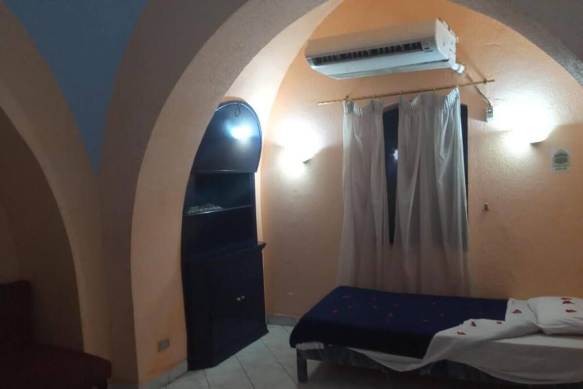 Quarto triplo standard, sacada, vista para o jardim