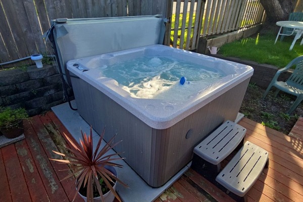 Unwind in your private hot tub on the wooden deck, surrounded by mature trees and complete privacy for the perfect evening soak.