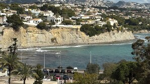 A coastal town with buildings, a cliff, and a beach. - Mediterranean Dream Calpe (Calp)