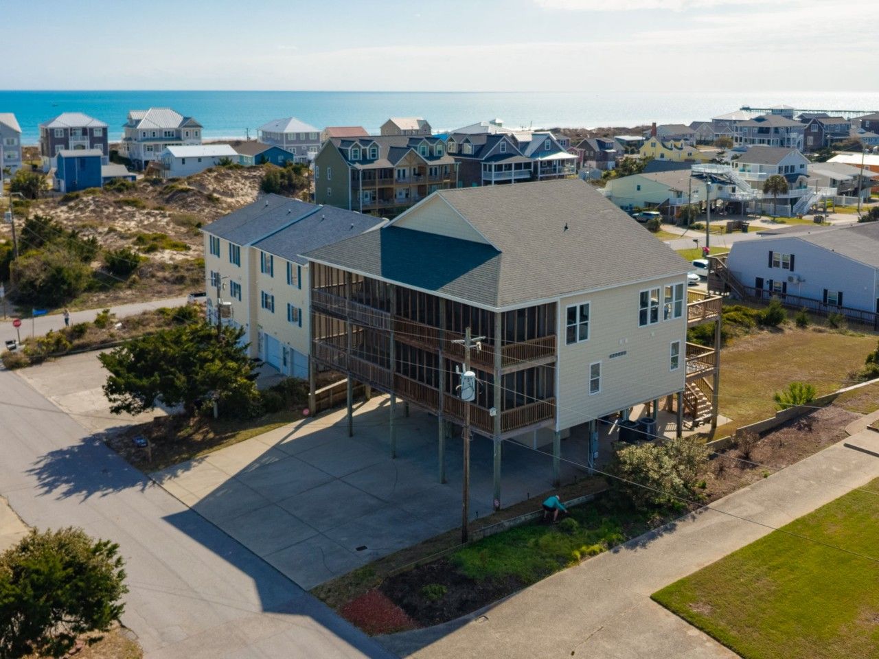 Waves on Willis, with the Atlantic waiting just beyond the rooftops. It`s a 5-minute walk from the carport to the sand: down Willis Avenue and through the sand trail.