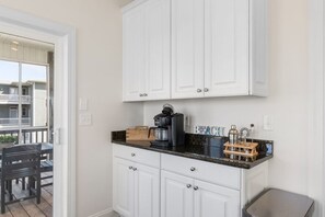 A dedicated coffee station for early risers: brew a cup before the beach and take it out to the porch. - Waves on Willis | Hot Tub · Sound Views · 4BR AB (Atlantic Beach)